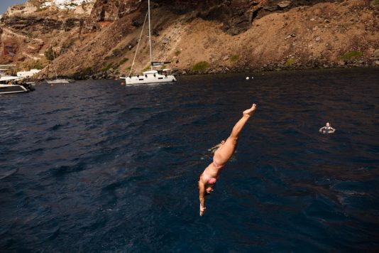 Person diving into the sea from a boat