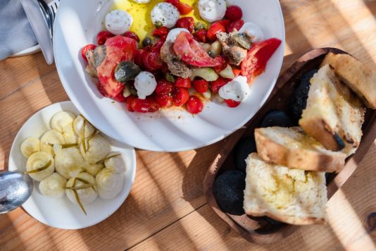 Mediterranean appetizers and bread on a table