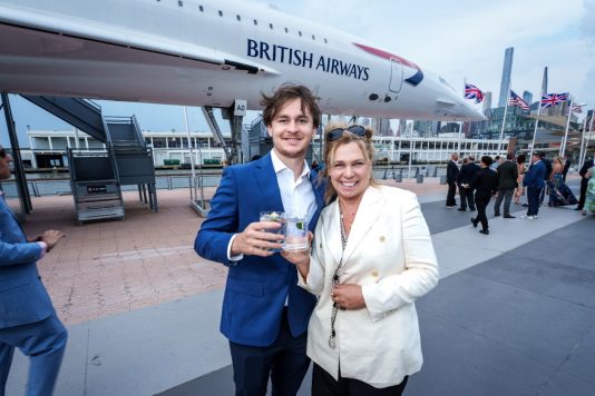 Guests posing beside Concorde
