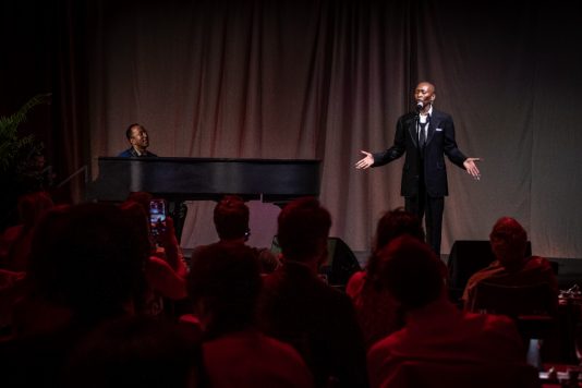 Cynthia Erivo performing with pianist