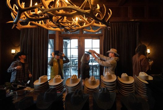 Guests selecting cowboy hats