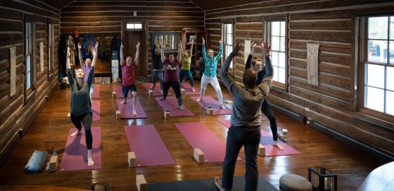 Group yoga session in lodge