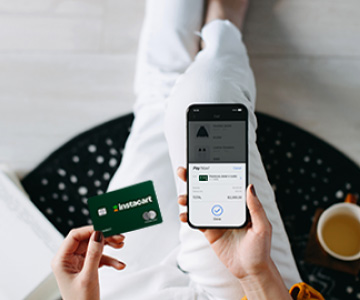 Woman adding Instacart Mastercard to mobile device