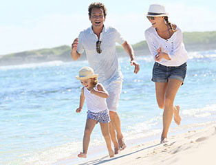 Family running on beach