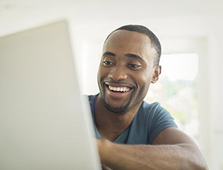 Man browsing on laptop